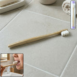 Wooden handle tooth cleaning brush